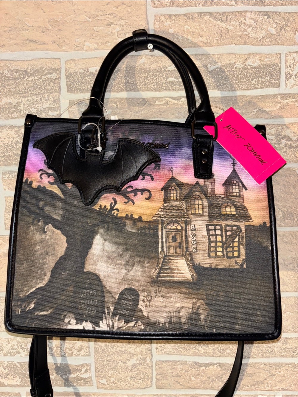 Betsey Johnson Black Satchel with Purple-Pink Sunset Haunted House bat Art